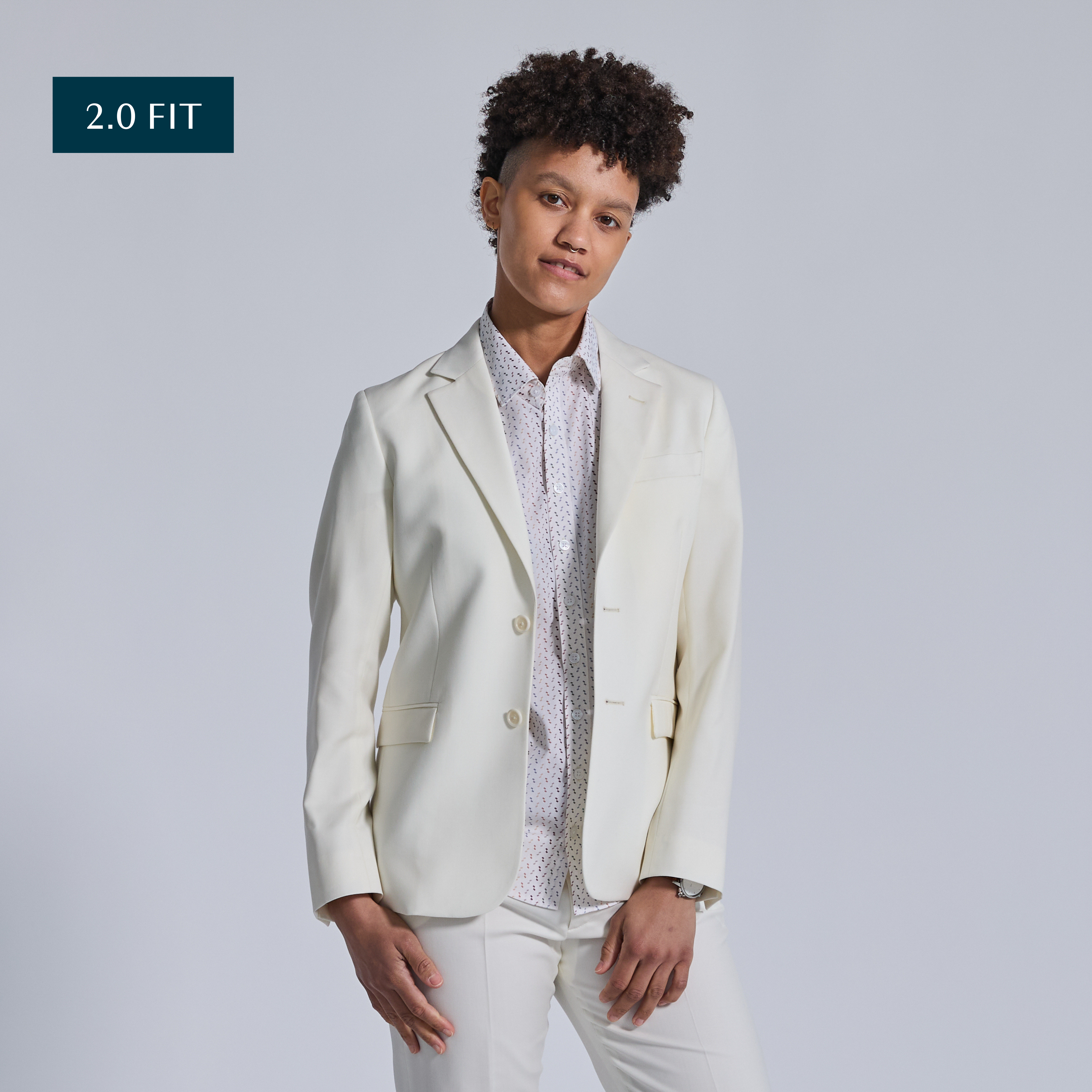 Non-binary model in Ivory Wedding Suit by Kirrin Finch