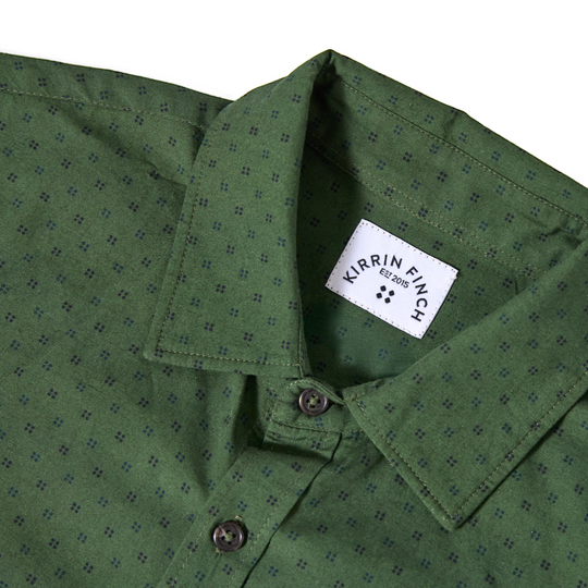 Close up of Pine KF Emblem Point Collar Shirt and Kirrin Finch logo.