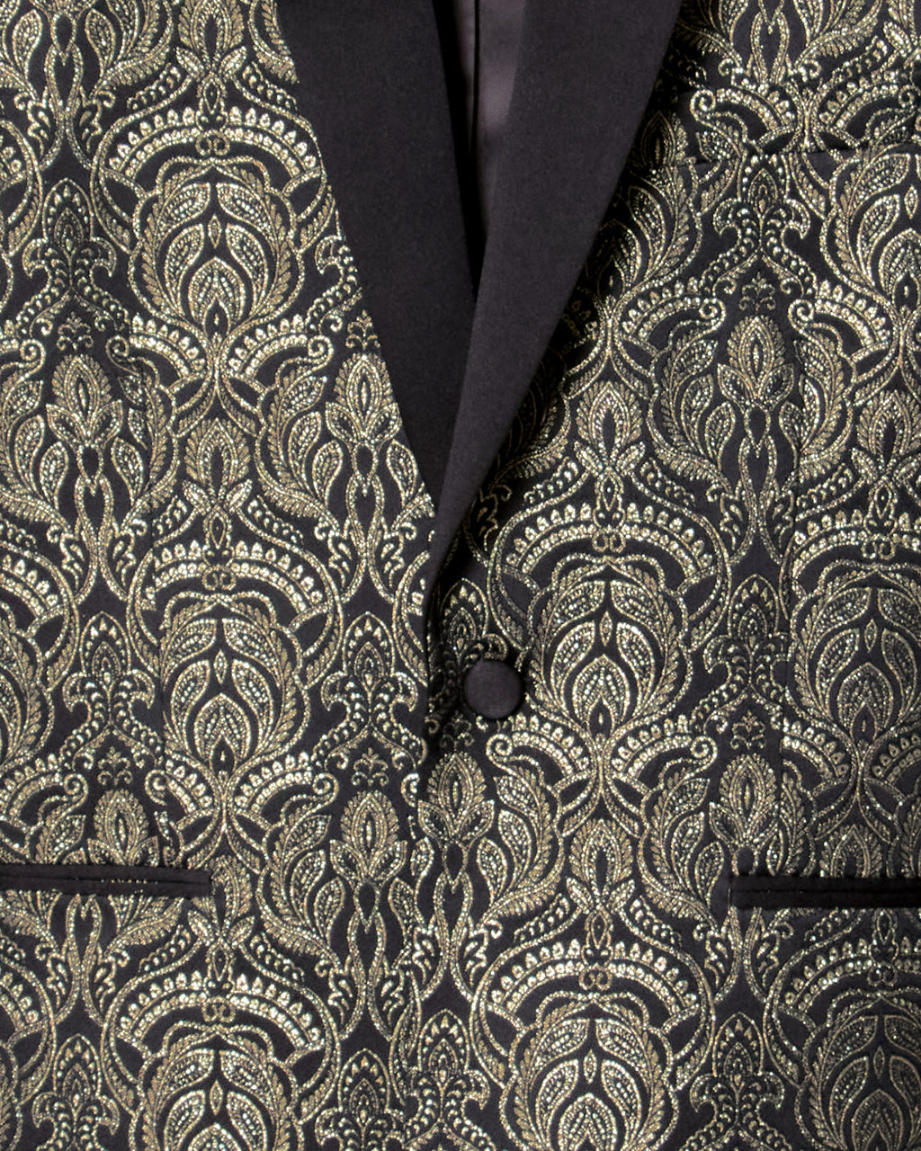 Close-up of a black and gold patterned suit jacket. Color: Gilded Brocade