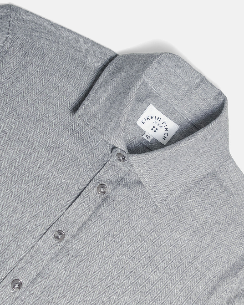 Close-up of a light gray textured button-down shirt collar showing the fabric weave and button details. Color: Pewter Herringbone