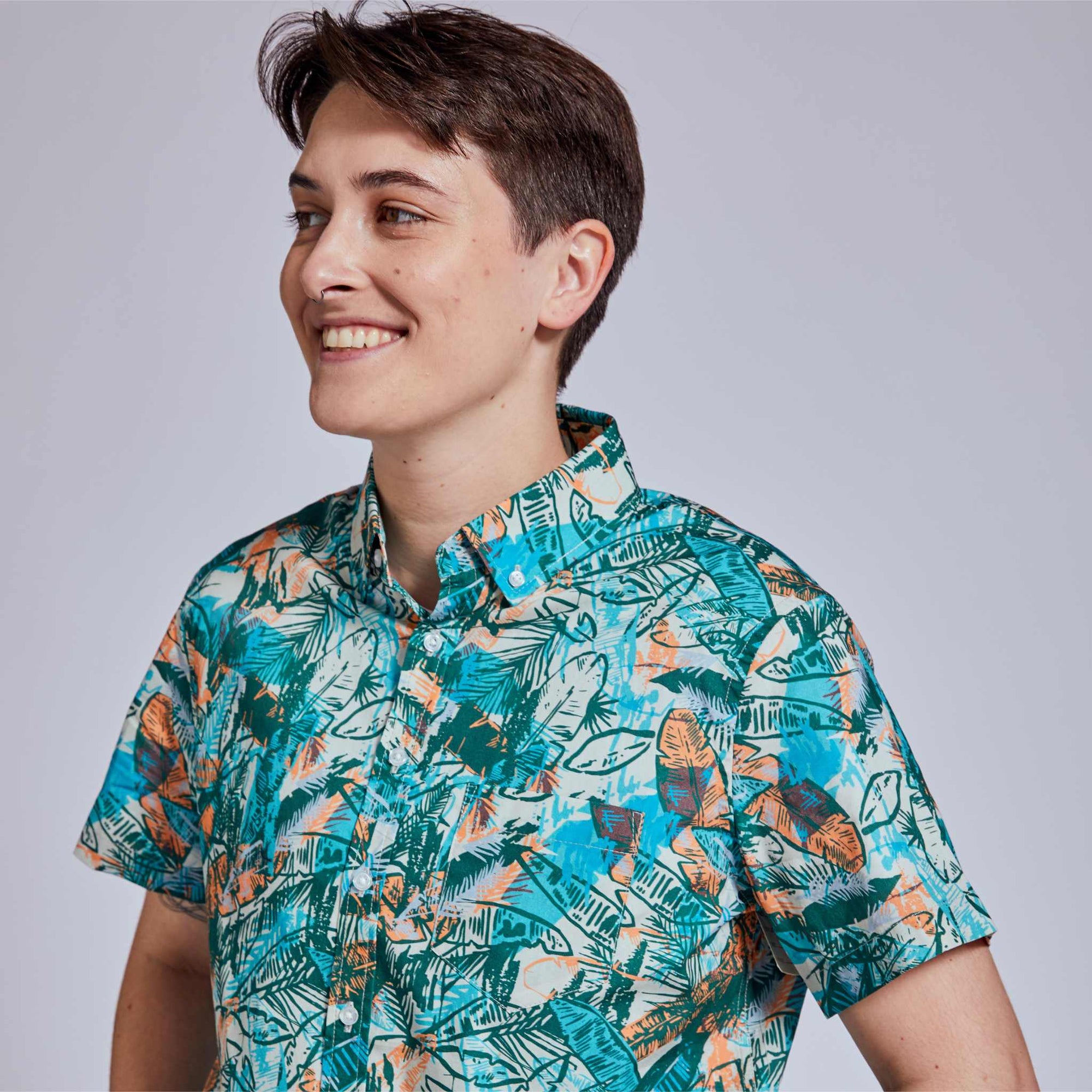 Non-Binary model in androgynous short sleeve shirt