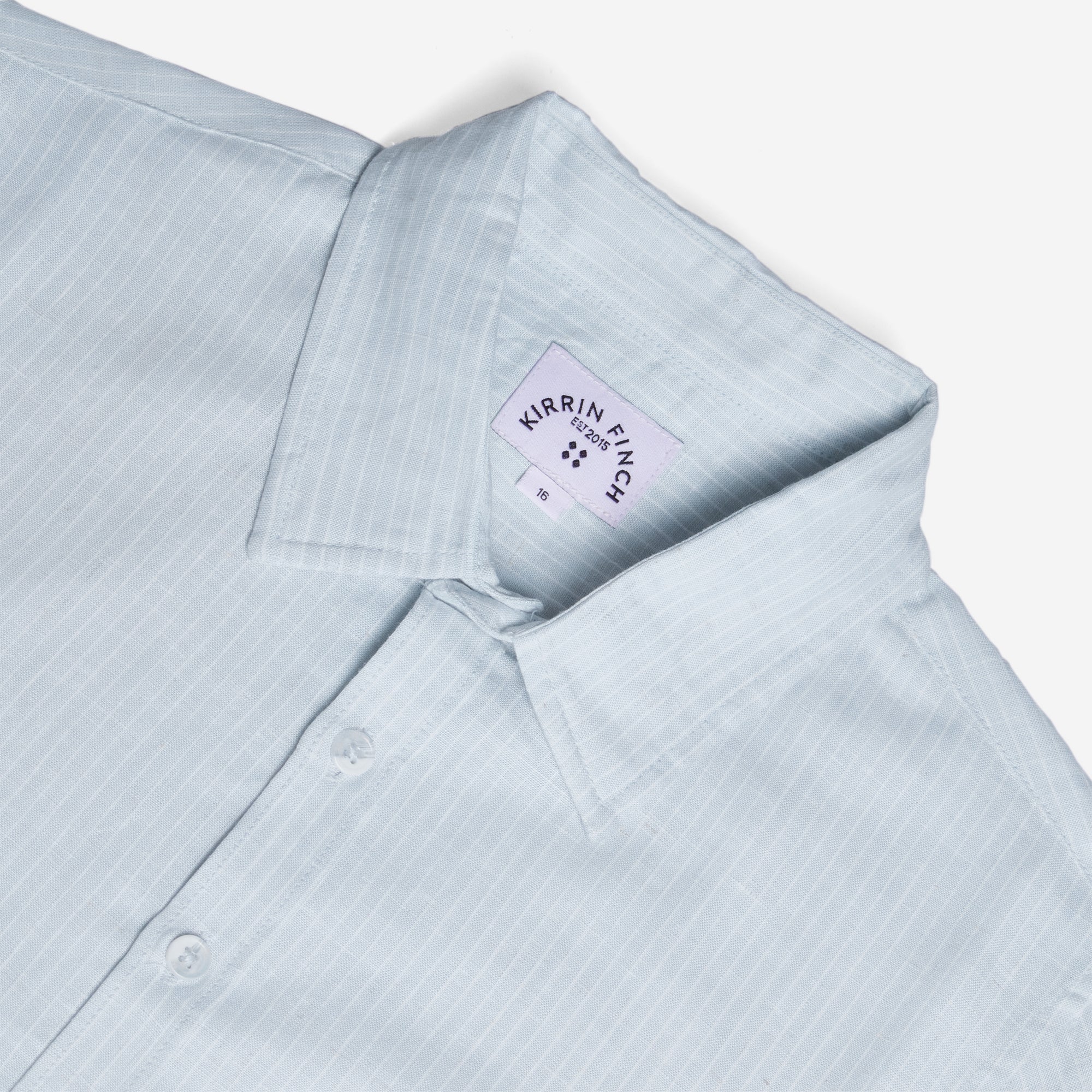Light blue shirt with a visible brand label on a white background. Color: Curacao