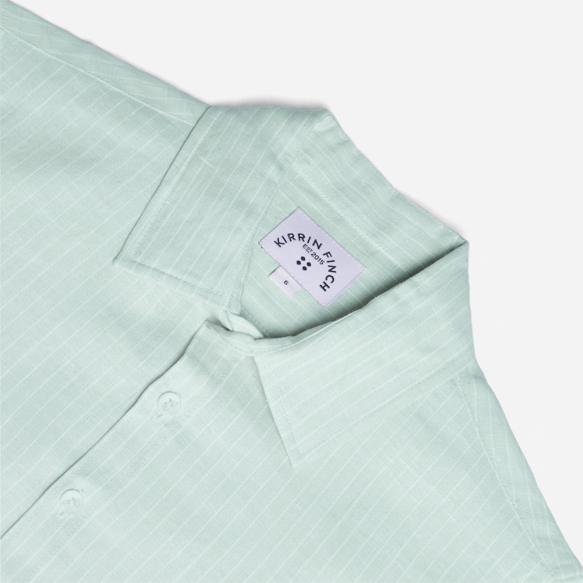 Light green shirt with a brand label on a white background. Color: Mojito