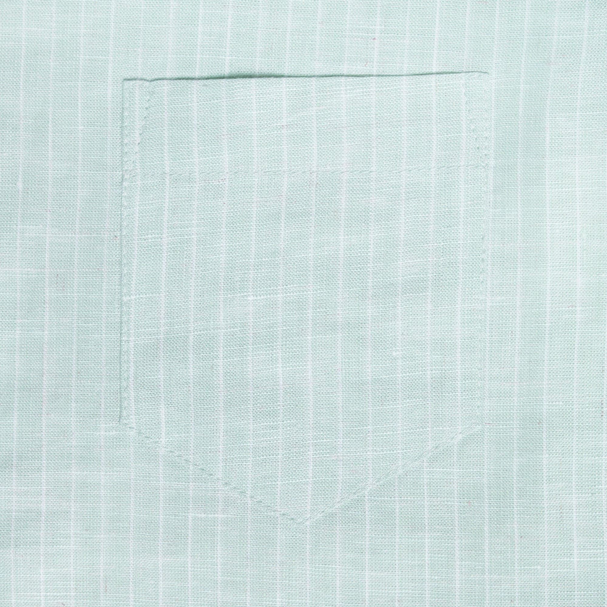 Close-up of light green shirt pocket. Color: Mojito