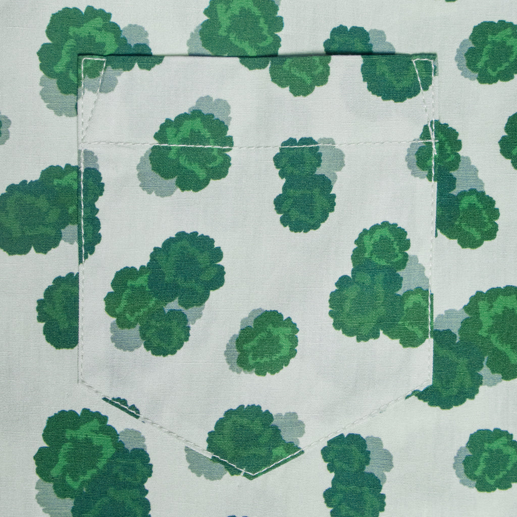 Green leaf pattern on a white background with a pocket. Color: Green Carnation