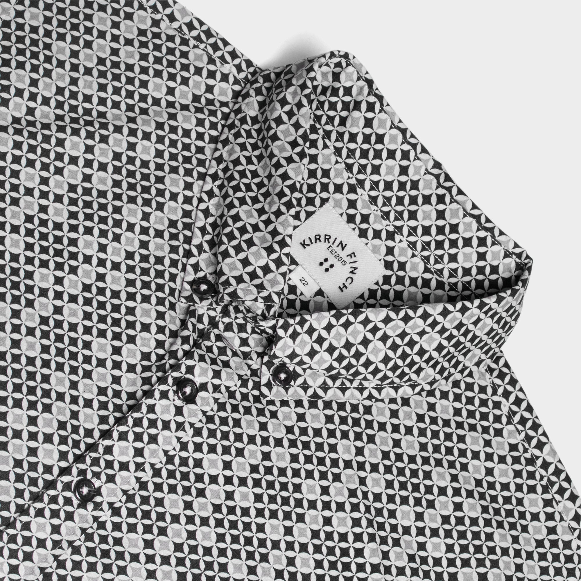 Close-up of a patterned Ray shirt on a white background. Color: Nova