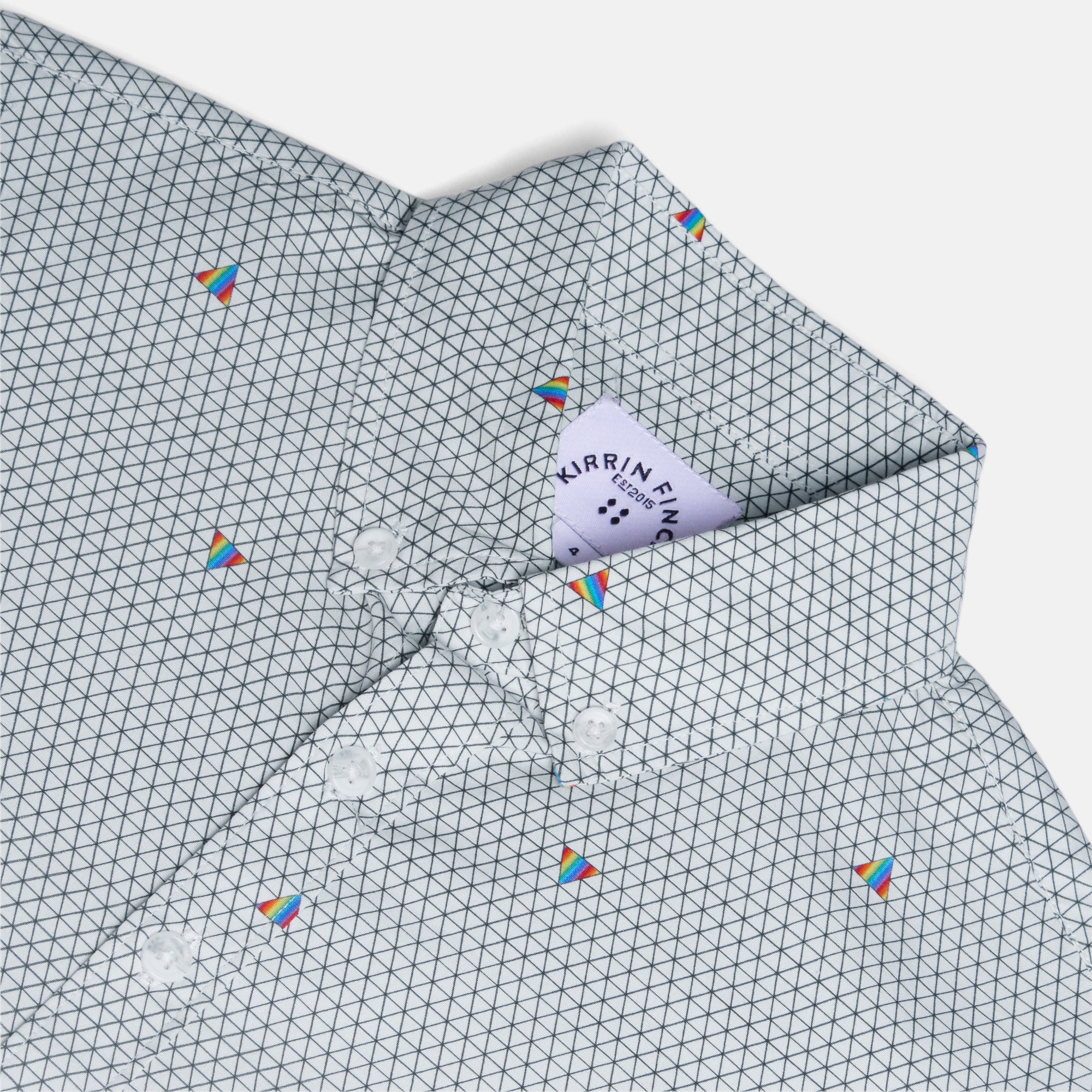 Close-up of a geometric patterned Ray shirt with small colorful prisms.  Color: Pride Prism