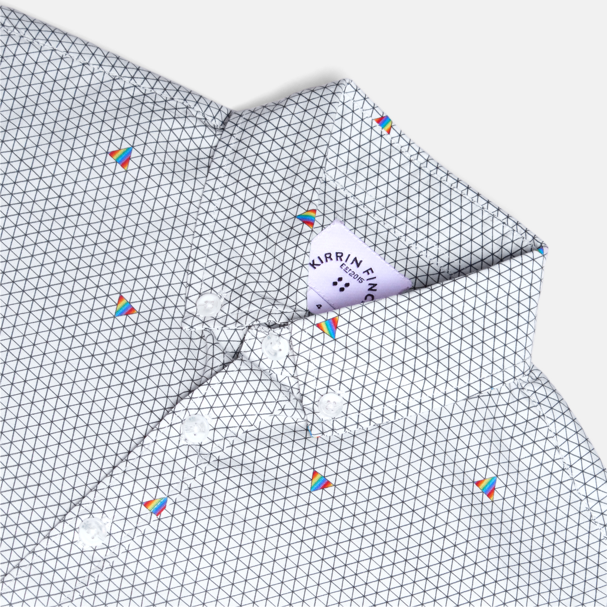 Close-up of a geometric patterned Ray shirt with small colorful prisms.  Color: Pride Prism