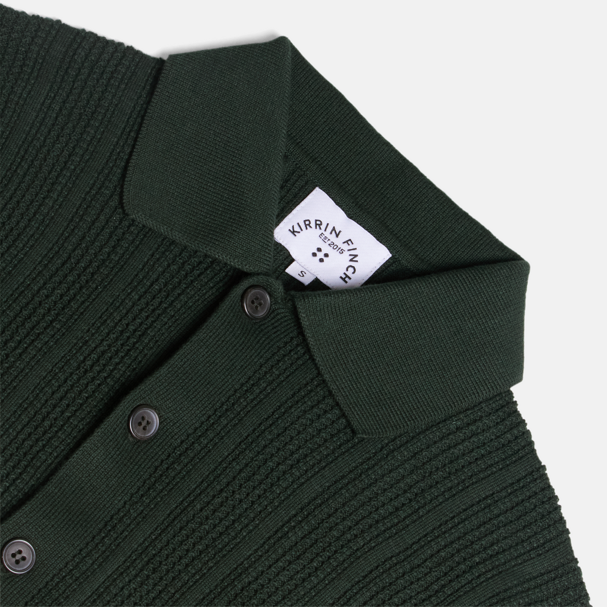 Androgynous green knitted cardigan on a light gray background. Color: Evergreen