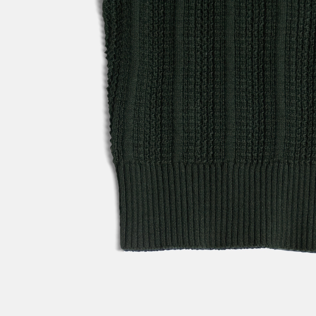 Ribbed cuff of dark green cardigan made by Kirrin Finch.  Color: Evergreen