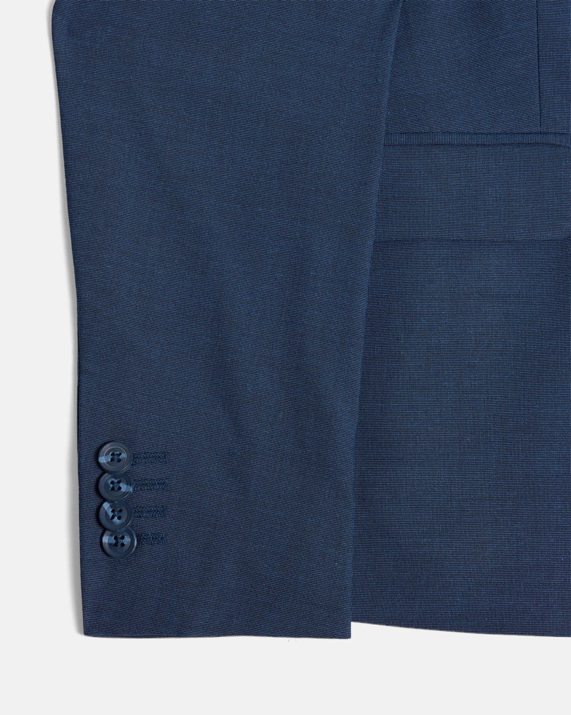 Close-up of blue blazers cuff buttons on a white background. Color: Atlantic Blue