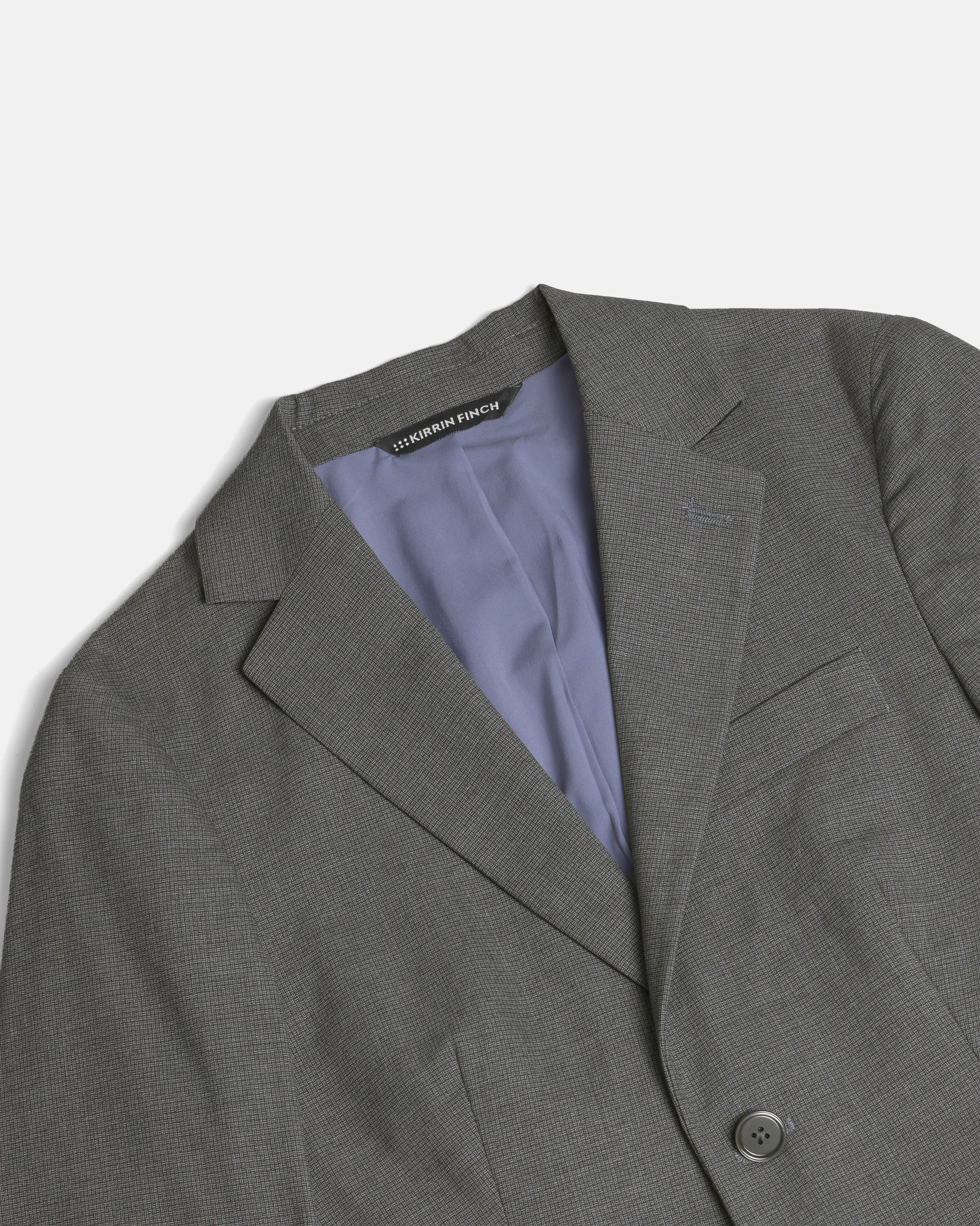 Gray blazer with a Kirrin Finch label on a light gray background. Color: Gray Lattice