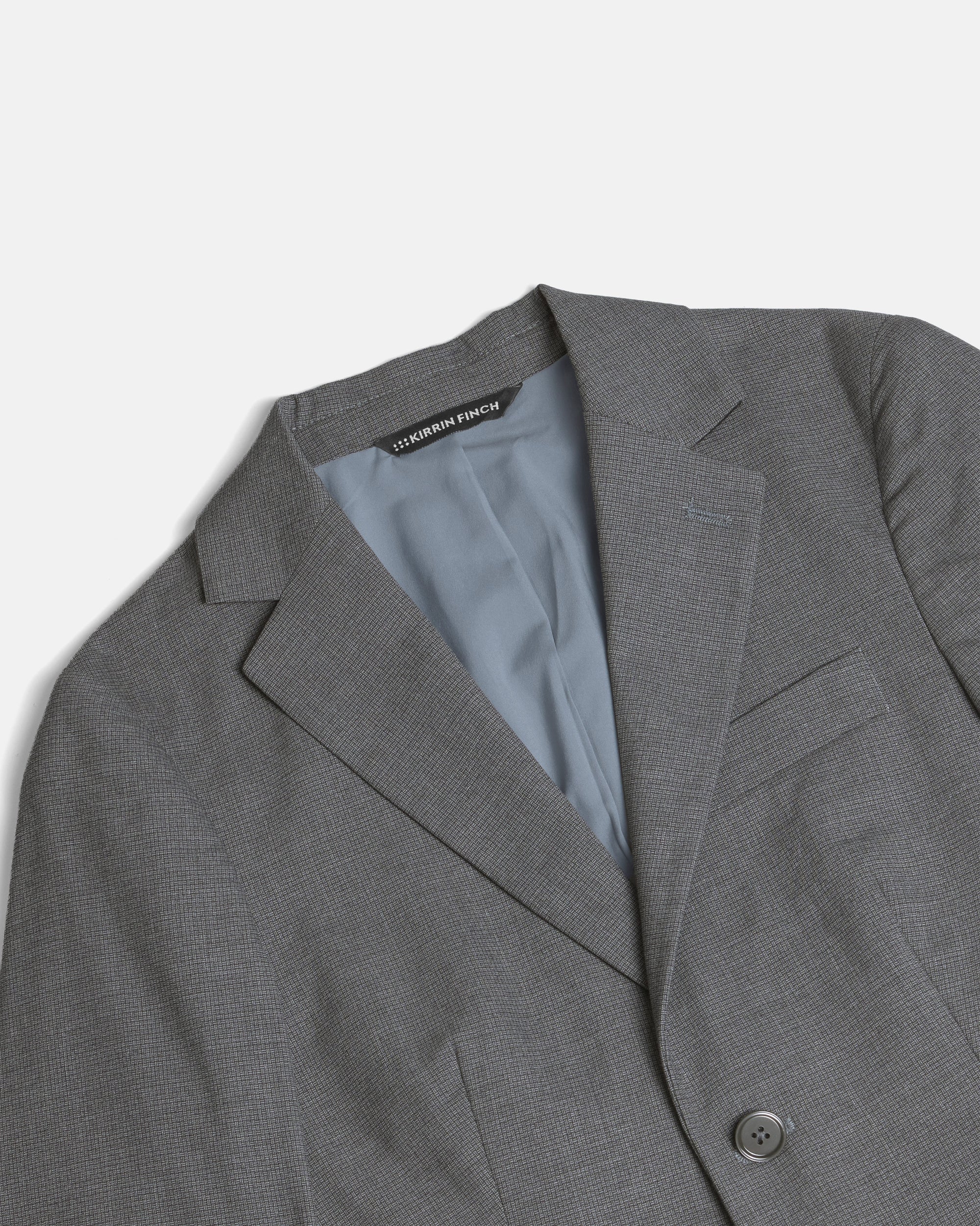 Gray blazer with a Kirrin Finch label on a light gray background. Color: Gray Lattice
