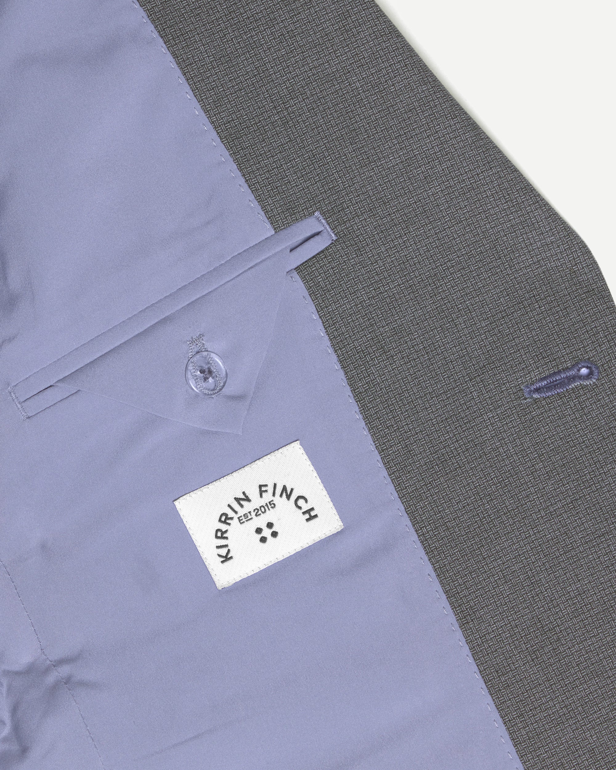Close-up of the inner pocket of the scout blazer. Color: Gray Lattice