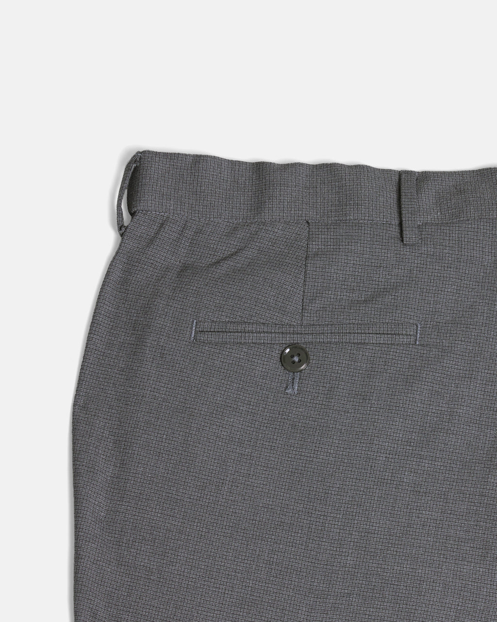 Close-up of gray patterned pants on a light gray background. Color: Gray Lattice