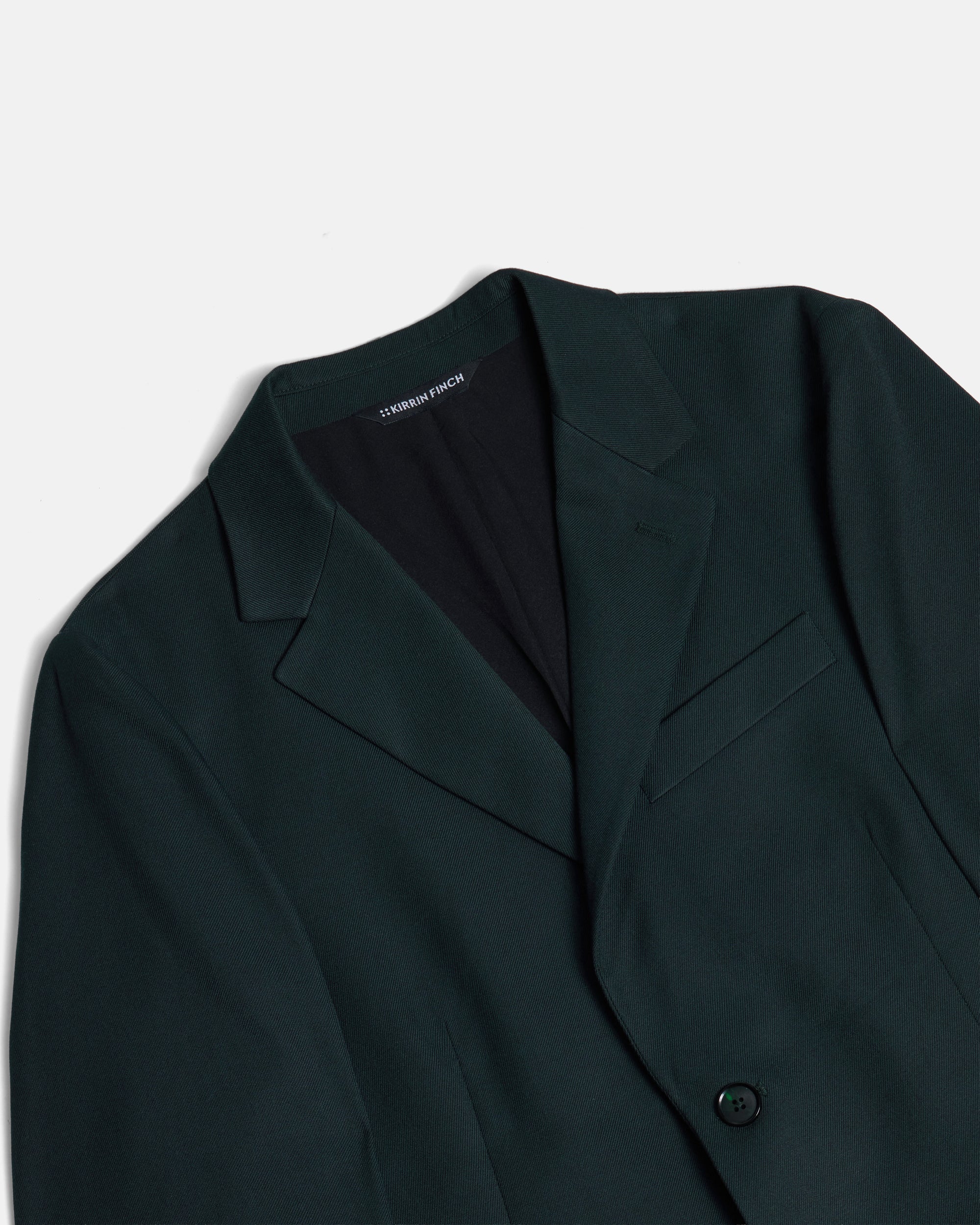 Dark green blazer on a light gray background. Color: Phantom Green Twill
