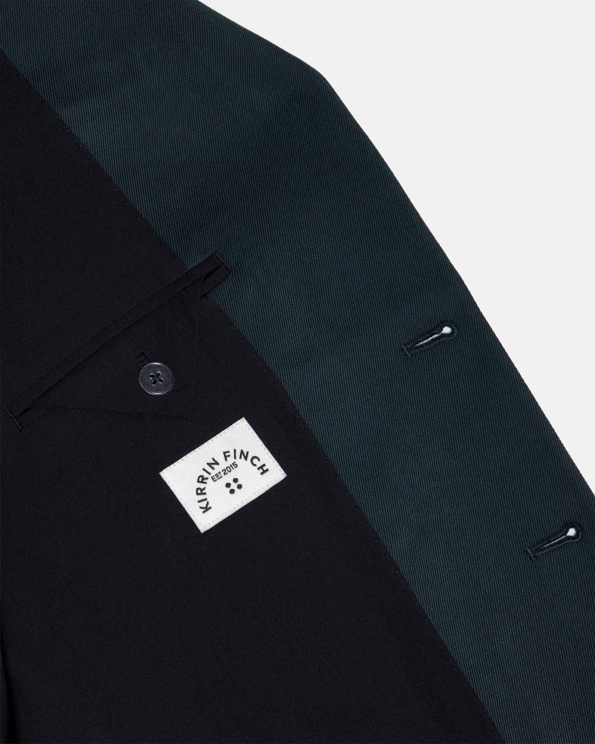 Dark Green suit jacket with a Kirrin Finch label on a white background. Color: Phantom Green Twill
