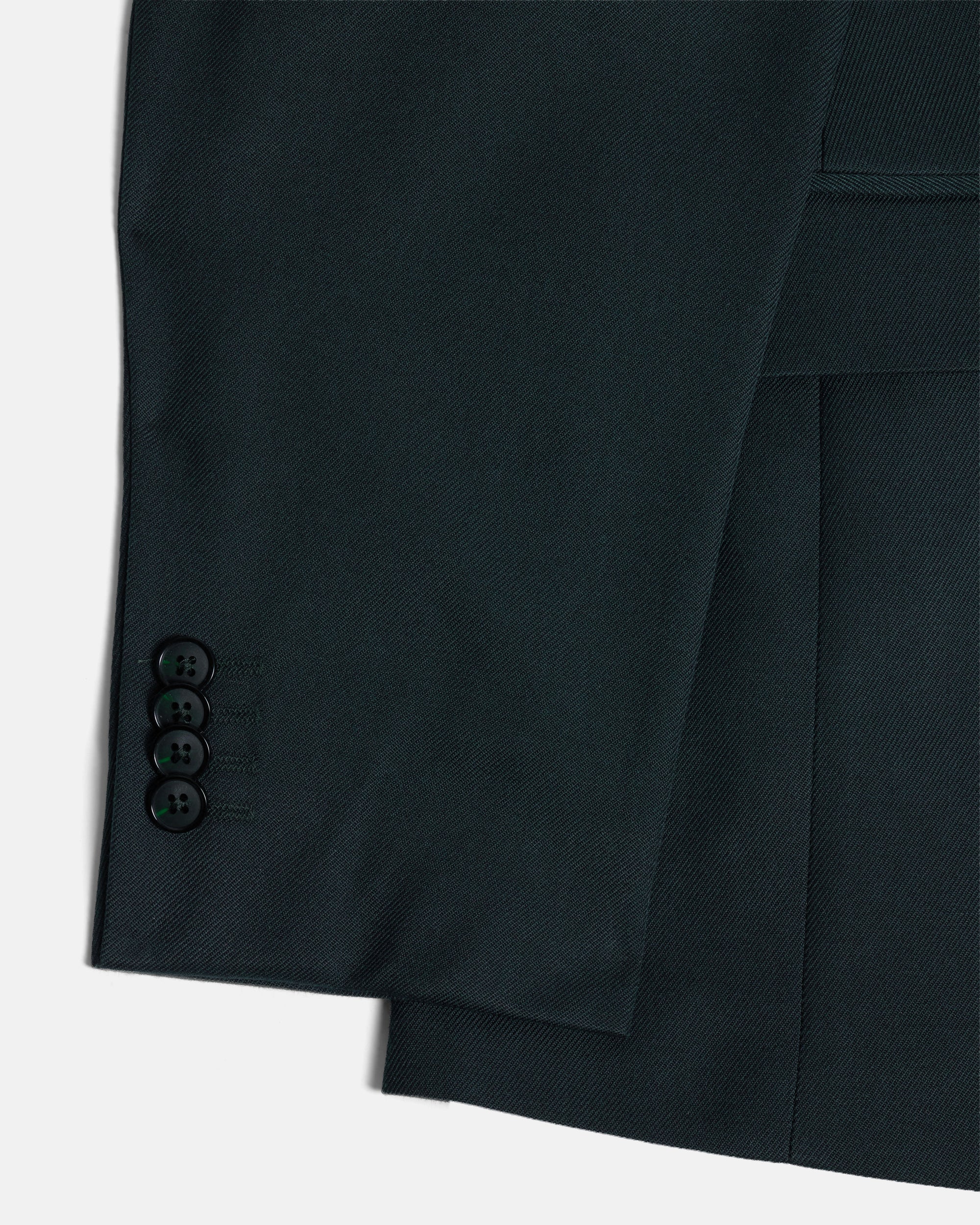 Close-up of a green suit jacket with button details on a white background. Color: Phantom Green Twill