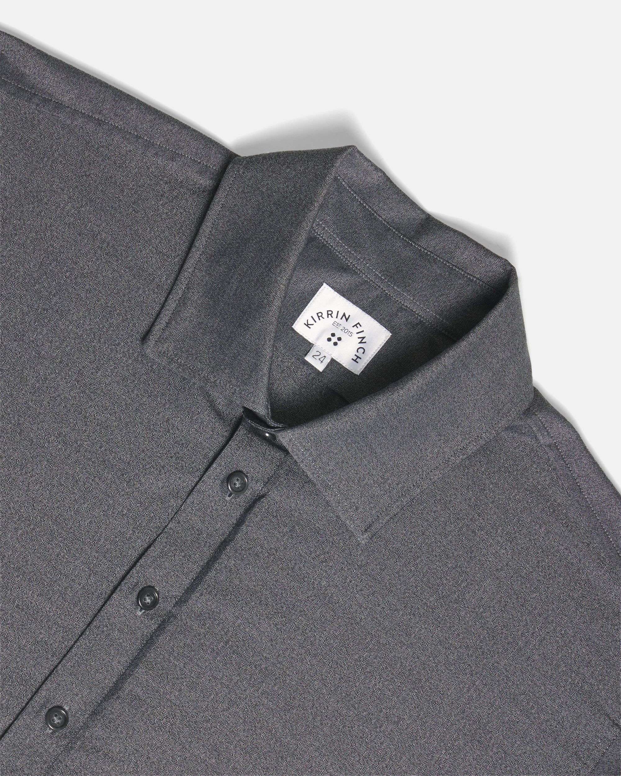 Close-up of a dark gray button-down shirt collar. Color: Steel Marl Herringbone