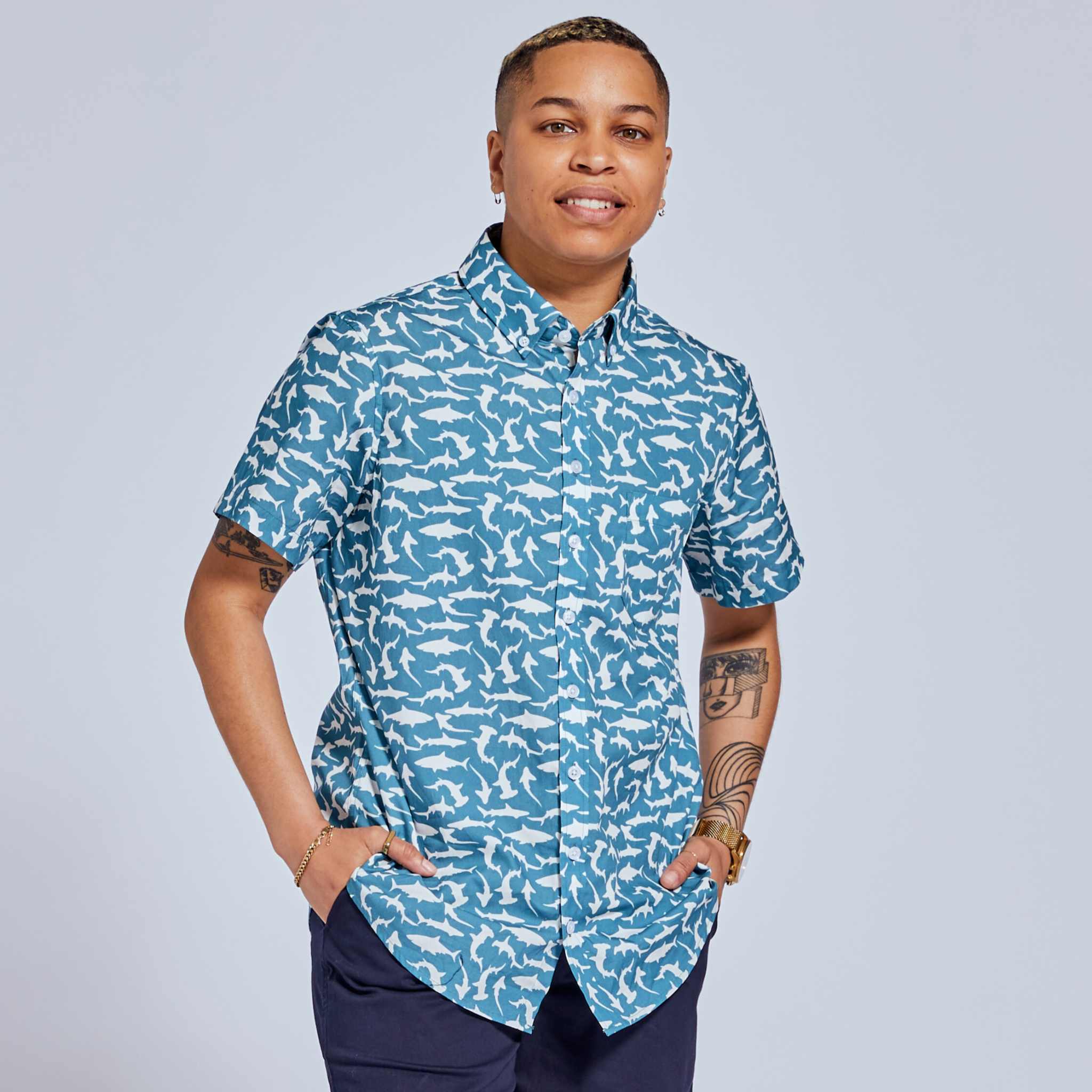 Androgynous short sleeve button up shirt on masculine presenting model