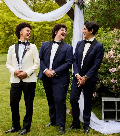 Three persons in the Kirrin Tuxedo at a Park wedding