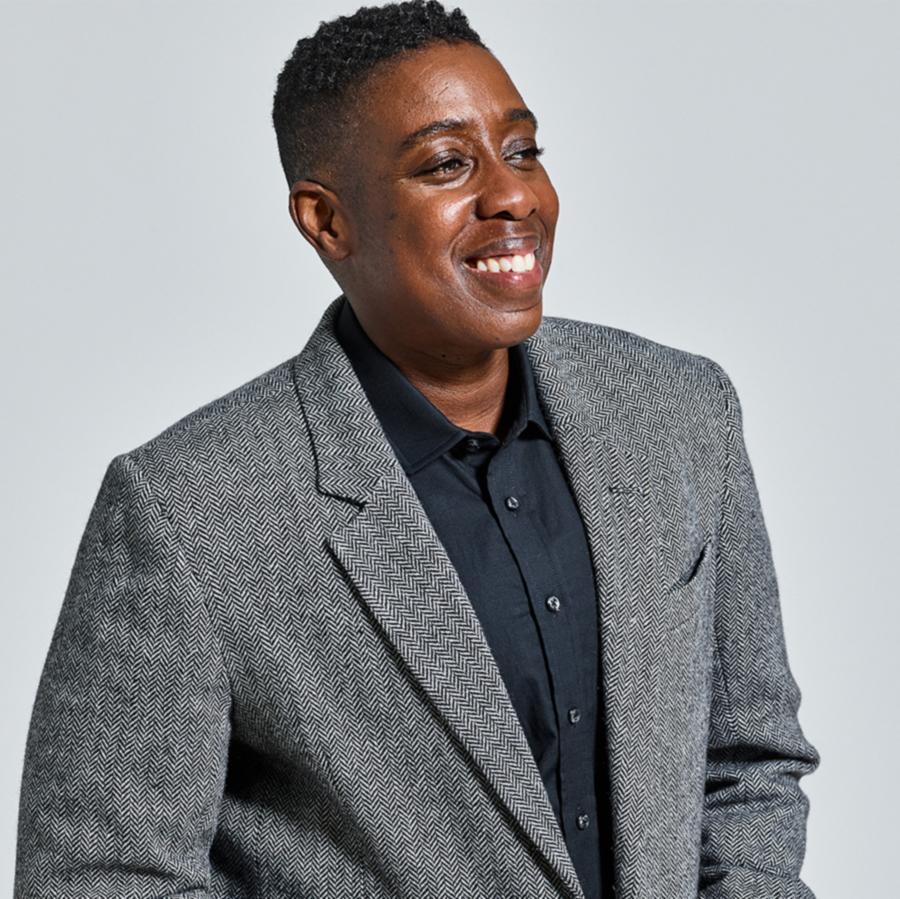 Model wearing black classic dress shirt under charcoal tweed blazer by Kirrin Finch