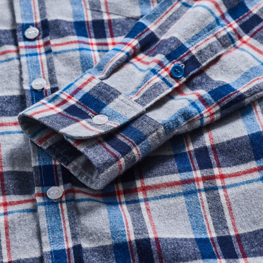 Gray, blue, and red brushed flannel sleeve with blue button detail