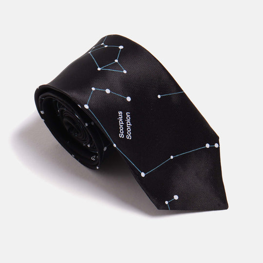 Black Skinny Tie with a constellation print by Kirrin Finch. Shown at a 3/4 angle on a white background