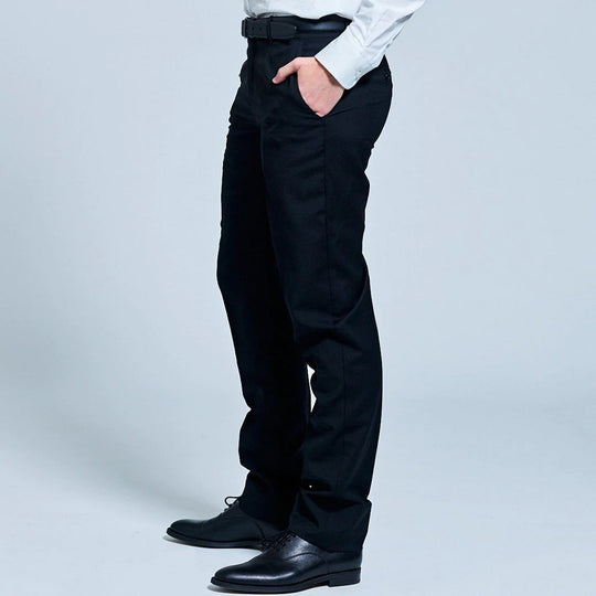 Side view of georgie black dress pants. The model has hand inside the deep front pocket
