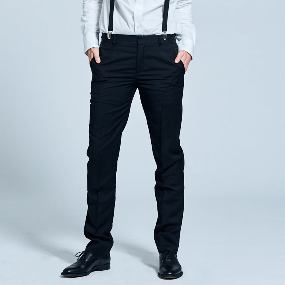 Androgynous model wearing Georgie black dress pants held up with suspenders