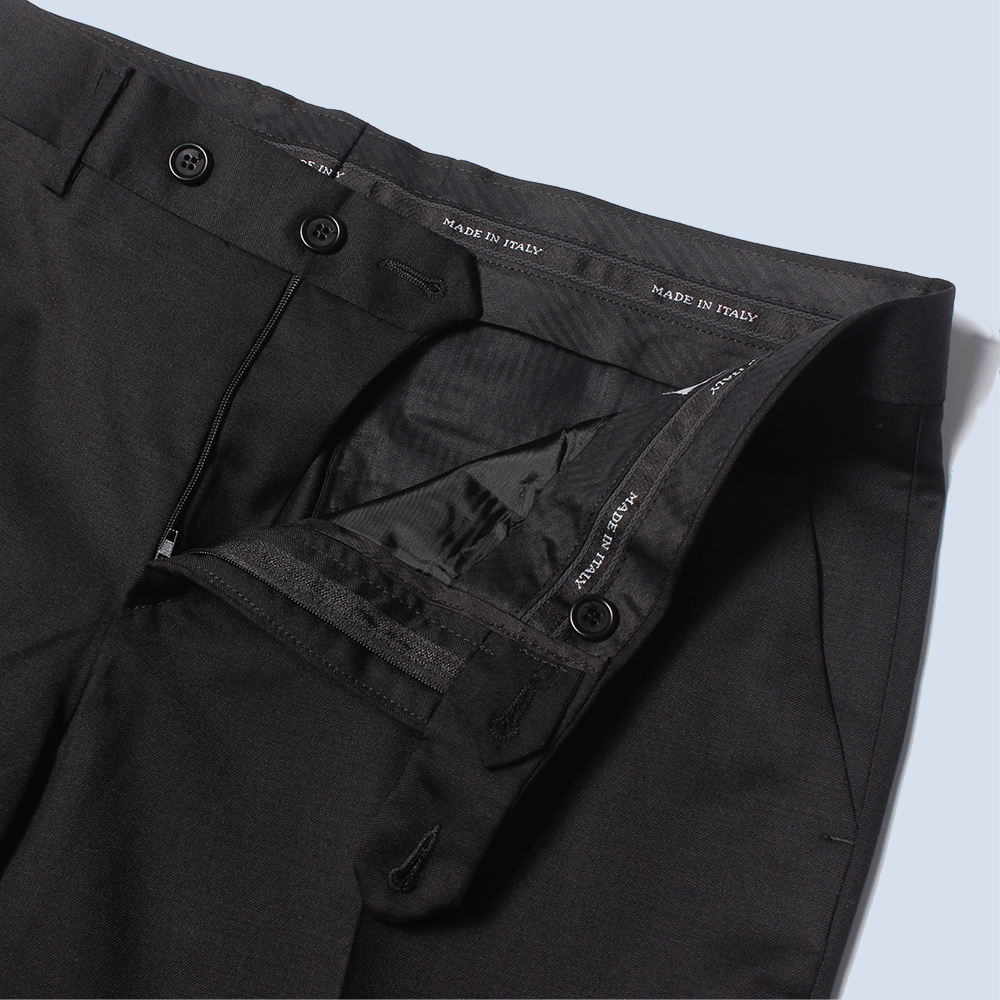 The Black georgie dress pants zipper open and button clasp side peeled back to reveal Made in Italy waistband detail. Color: Black