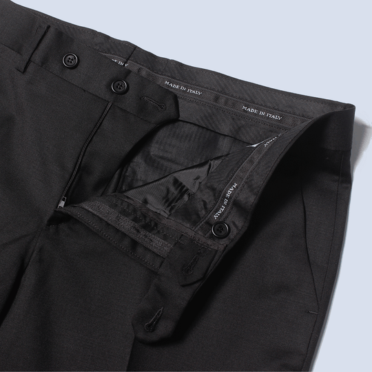 The Black georgie dress pants zipper open and button clasp side peeled back to reveal Made in Italy waistband detail