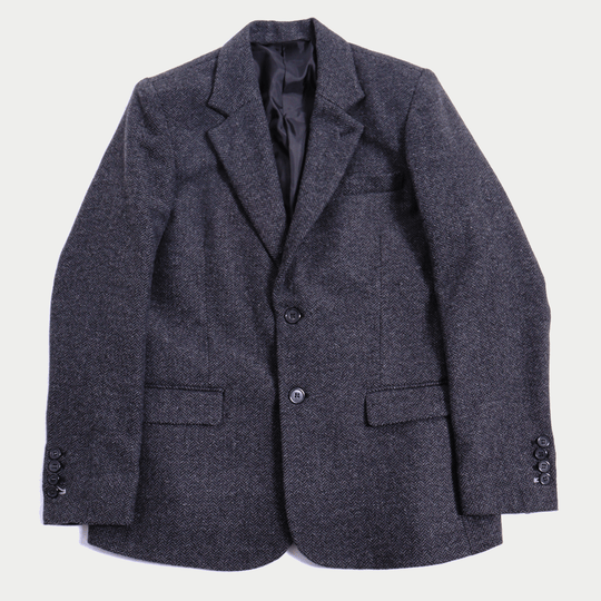 Gender Inclusive Charcoal Tweed Blazer against a very light gray background