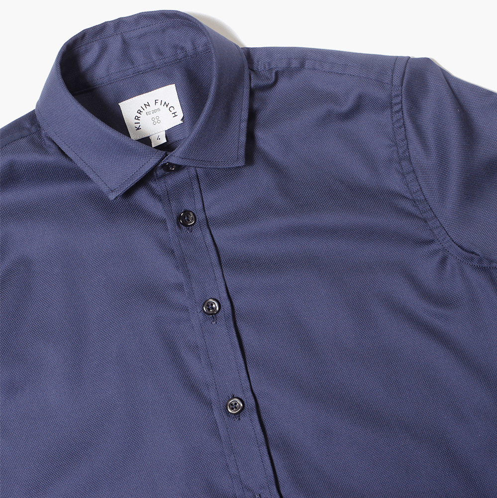 Flat lay of the Navy Addams Easy-care dress shirt made for women, trans, masc and non-binary folk. Color: Navy