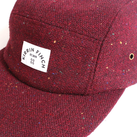 Wool Burgundy hat with light color confetti details and Kirrin Finch logo on front