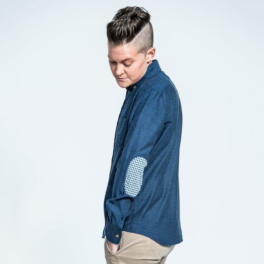 Model looking down towards their super cool gingham elbow patch on Kirrin Finch's brushed navy flannel